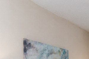 Open living room with tile flooring and a ceiling fan